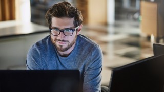 Businessman working at computer in office